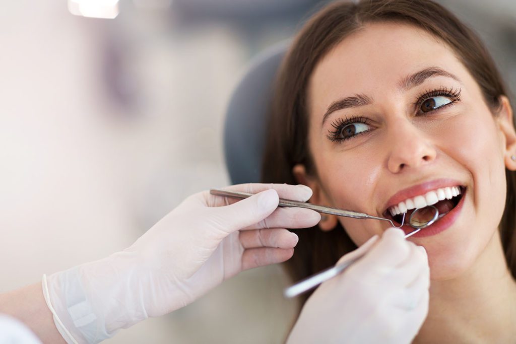 Woman getting her teeth examined at the dentist dentist in Medford New Jersey